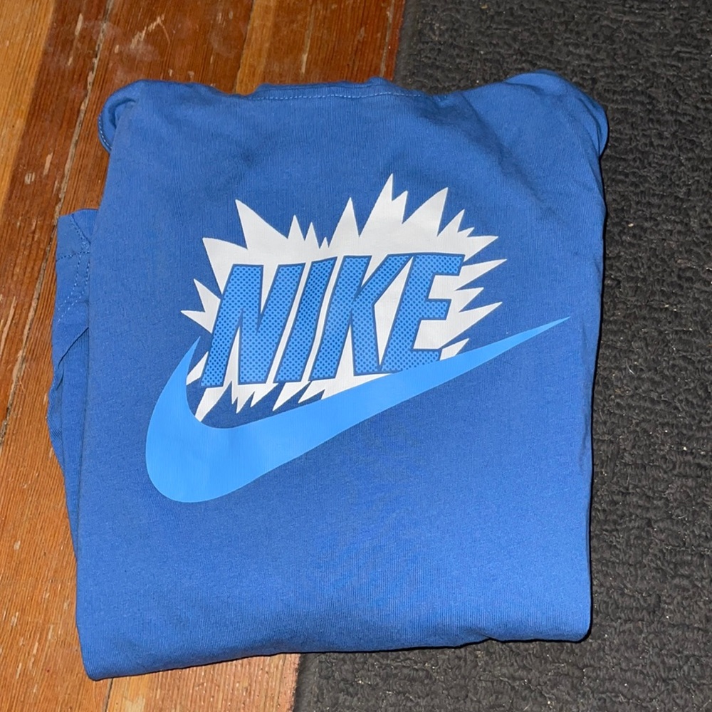 One blue Nike hoodie
